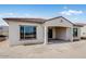 Exterior back elevation of a new home with covered patio and tile roof at 5779 N 207Th Ave, Buckeye, AZ 85396
