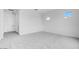Bright bedroom featuring a large window, plush carpeting and neutral paint at 5779 N 207Th Ave, Buckeye, AZ 85396