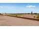 Scenic view of a golf course community with desert landscaping and blue skies at 5779 N 207Th Ave, Buckeye, AZ 85396