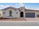 Charming single-story home with a tile roof, arched entry and low maintenance desert landscaping at 5779 N 207Th Ave, Buckeye, AZ 85396