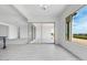 An open living space offers seamless transitions to the outdoors with expansive windows and doors at 5779 N 207Th Ave, Buckeye, AZ 85396