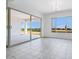 Bright living room boasts tile floors, offering serene views and easy access to the outdoor area at 5779 N 207Th Ave, Buckeye, AZ 85396