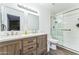 Bathroom featuring a double sink vanity, modern fixtures, and glass door shower at 6262 E Brown Rd # 30, Mesa, AZ 85205