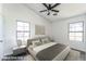 Staged bedroom with a neutral palette, complemented by natural light from the windows at 6262 E Brown Rd # 30, Mesa, AZ 85205