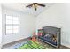 Bedroom/bedroom with ceiling fan, playful decor, and a comfy gray crib at 6262 E Brown Rd # 30, Mesa, AZ 85205