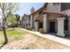 Townhome showcasing tidy landscaping and a walkway leading to the front door at 6262 E Brown Rd # 30, Mesa, AZ 85205