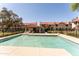 Inviting community pool with lounge chairs, set amongst well-maintained residential buildings at 6262 E Brown Rd # 30, Mesa, AZ 85205