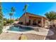 Private backyard oasis featuring a pool, mature landscaping, and cozy lounge spaces at 6350 S Wilson Dr, Chandler, AZ 85249