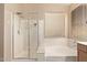 Clean and bright bathroom featuring shower and tub combination and a large window for natural light at 6350 S Wilson Dr, Chandler, AZ 85249