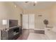 Comfortable bedroom with wood floors, entertainment center and a comfortable couch at 6350 S Wilson Dr, Chandler, AZ 85249