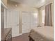 This bedroom features wood floors, a neutral color scheme, and built-in closet space at 6350 S Wilson Dr, Chandler, AZ 85249