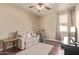 Well-lit room featuring wood floors, a comfortable couch, and exercise equipment at 6350 S Wilson Dr, Chandler, AZ 85249