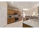 Well-equipped kitchen with granite counters, wooden cabinets, and stainless steel appliances at 6350 S Wilson Dr, Chandler, AZ 85249
