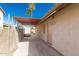 Side view of backyard with covered patio at 654 W Natal Cir, Mesa, AZ 85210