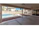 Relaxing backyard patio with views of the swimming pool and desert landscaping at 654 W Natal Cir, Mesa, AZ 85210