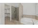 Bathroom with a glass-door shower, soaking tub and granite countertops at 654 W Natal Cir, Mesa, AZ 85210