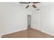 Bedroom featuring wood-look floors, closet, ceiling fan and neutral walls at 654 W Natal Cir, Mesa, AZ 85210