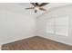 Inviting bedroom with wood-look floors and natural light creating a calming atmosphere at 654 W Natal Cir, Mesa, AZ 85210