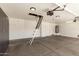 Organized garage with built-in storage, access ladder, and water heater at 654 W Natal Cir, Mesa, AZ 85210