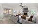 Staged living room featuring fireplace, sliding glass doors, and view of outdoor pool at 654 W Natal Cir, Mesa, AZ 85210
