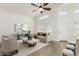 Staged living room showcases vaulted ceiling, tile flooring, and comfortable seating arrangement at 654 W Natal Cir, Mesa, AZ 85210