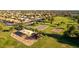 Aerial view of neighborhood park featuring a playground and basketball court at 654 W Natal Cir, Mesa, AZ 85210