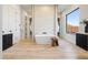 Bright bathroom showcasing soaking tub, walk-in shower, modern fixtures and stylish vanity at 670 E Woburn Ln, Phoenix, AZ 85085