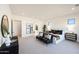 Bright bedroom featuring stylish furnishings, neutral decor, and ample natural light at 670 E Woburn Ln, Phoenix, AZ 85085