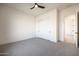 Bright bedroom boasting ample space, closet, and a ceiling fan for comfort at 670 E Woburn Ln, Phoenix, AZ 85085