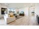 Bright living room featuring modern furnishings, light wood floors, and a view of the outdoors at 670 E Woburn Ln, Phoenix, AZ 85085