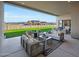 Spacious covered patio featuring comfortable seating, an outdoor space with views of the neighborhood at 670 E Woburn Ln, Phoenix, AZ 85085