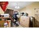 Bedroom filled with boxes, fans, and various objects at 6960 W Peoria Ave # 29B, Peoria, AZ 85345