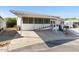 Charming home exterior with covered parking and ramp access, offering convenience and accessibility at 6960 W Peoria Ave # 29B, Peoria, AZ 85345