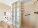 Bright bathroom with tub, glass block partition, and shower with handrails at 7220 E Mary Sharon Dr # 116, Scottsdale, AZ 85266