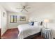 Bedroom with a queen bed, side table, and window for natural light at 7220 E Mary Sharon Dr # 116, Scottsdale, AZ 85266