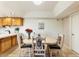 Bright dining area featuring a wooden table with desert-patterned chairs, perfect for entertaining at 7220 E Mary Sharon Dr # 116, Scottsdale, AZ 85266