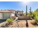 Inviting two-story home featuring a charming gated courtyard and desert landscaping at 7220 E Mary Sharon Dr # 116, Scottsdale, AZ 85266