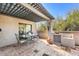 Cozy patio with outdoor kitchen, perfect for entertaining guests at 7220 E Mary Sharon Dr # 116, Scottsdale, AZ 85266