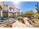 Charming patio with desert landscaping and comfortable seating, perfect for outdoor relaxation at 7220 E Mary Sharon Dr # 116, Scottsdale, AZ 85266