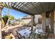 Charming covered patio area with ample space for dining and outdoor enjoyment at 7220 E Mary Sharon Dr # 116, Scottsdale, AZ 85266
