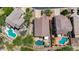 Scenic aerial view of home highlighting the pool and lush desert landscaping at 7544 E Sierra Morena Cir, Mesa, AZ 85207