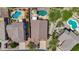 Captivating aerial shot showcasing a desert home's pool and mature landscaping at 7544 E Sierra Morena Cir, Mesa, AZ 85207