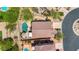 Beautiful aerial view of a home and yard with a private pool and green landscaping at 7544 E Sierra Morena Cir, Mesa, AZ 85207