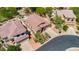 Single-story home with lush landscaping, tile roof, and spacious driveway in a quiet neighborhood at 7544 E Sierra Morena Cir, Mesa, AZ 85207