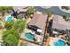 Aerial view of a backyard with a pool and lush landscaping, perfect for outdoor enjoyment and relaxation at 7544 E Sierra Morena Cir, Mesa, AZ 85207