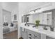 Elegant ensuite bathroom with double sinks, framed mirror, connecting to main bedroom at 7544 E Sierra Morena Cir, Mesa, AZ 85207