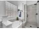 Spa bathroom features separate shower and soaking tub with glass block window at 7544 E Sierra Morena Cir, Mesa, AZ 85207
