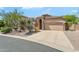 Stunning single-story home with desert landscaping, neutral stucco, and a tile roof at 7544 E Sierra Morena Cir, Mesa, AZ 85207