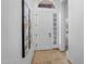 Bright entry with travertine flooring and glass block window at 7544 E Sierra Morena Cir, Mesa, AZ 85207