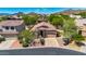 Charming single-story home with lush desert landscaping and mountain views, perfect for Southwest living at 7544 E Sierra Morena Cir, Mesa, AZ 85207